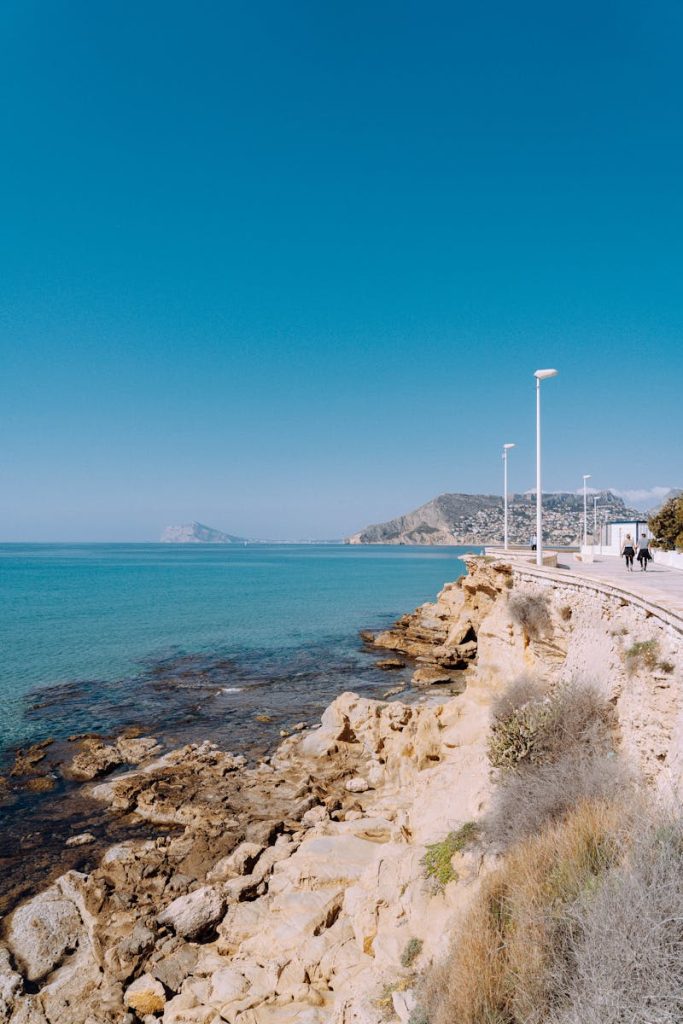 Rocky Shore Under Blue Sky