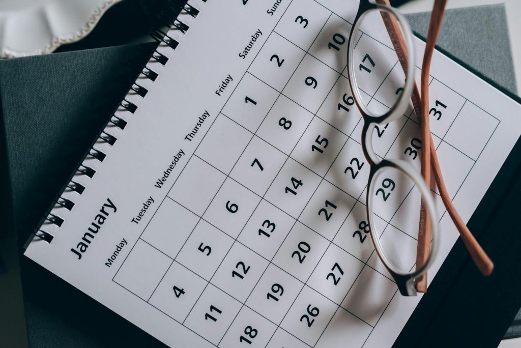 Brown-Framed Eyeglasses on a Calendar